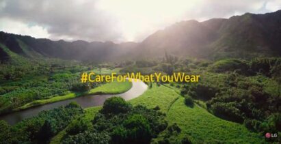 An image for LG's campaign, #CareForWhatYouWear for sustainable lifestyle, which displays a beautiful green landscape with trees, grass, and a river running through the middle