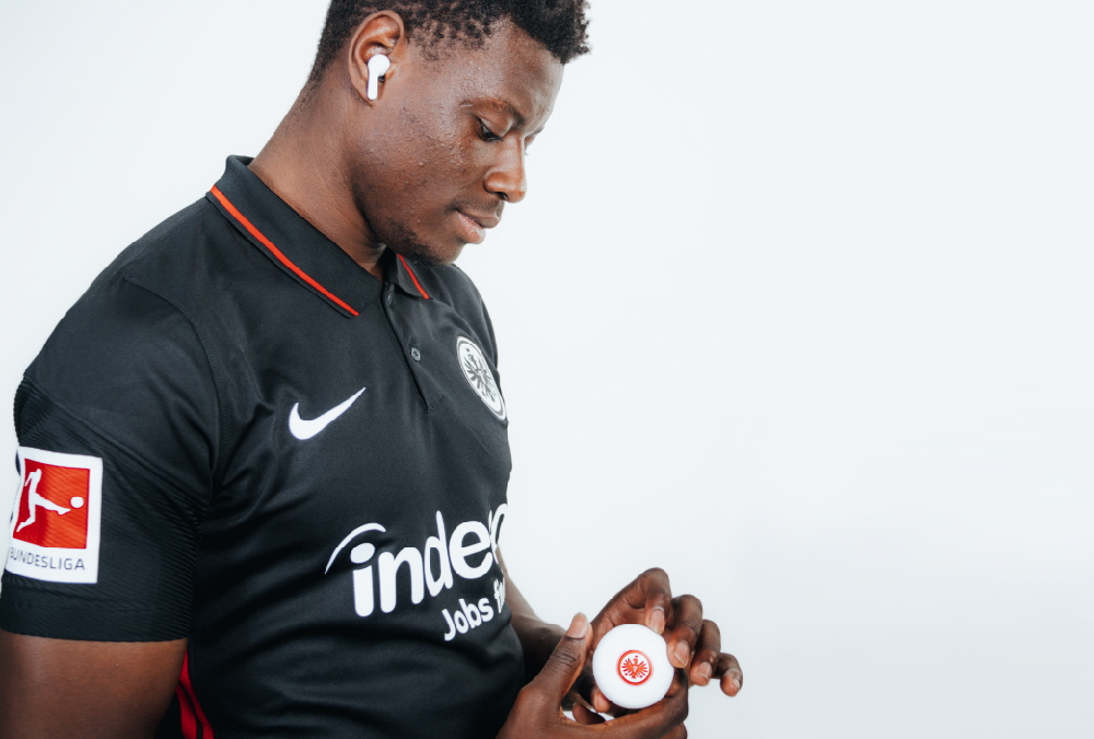 Ragnar Ache, who plays striker for the Bundesliga’s Eintracht Frankfurt football club, posing with the Eintracht Frankfurt TONE Free