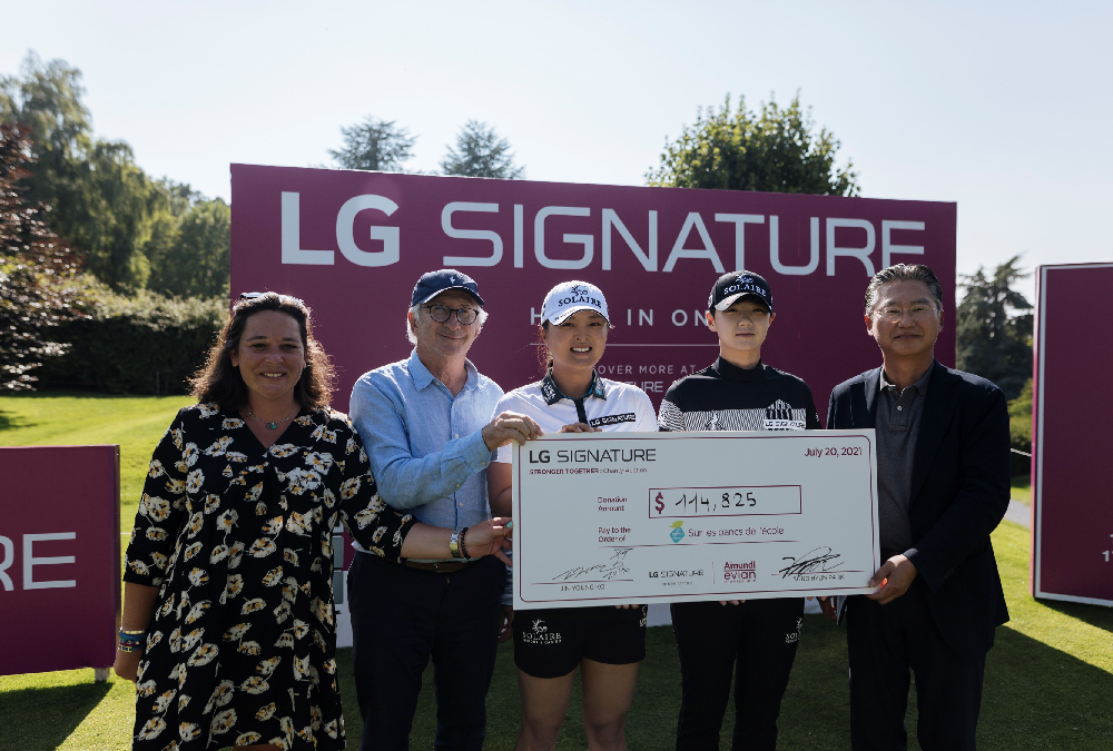 Justine Buisson, Franck Riboud, Ko Jin-young, Park Sung-hyun and Heaven Lee pose with a large check during the golf event to support online charity auction, "STRONGER TOGETHER"