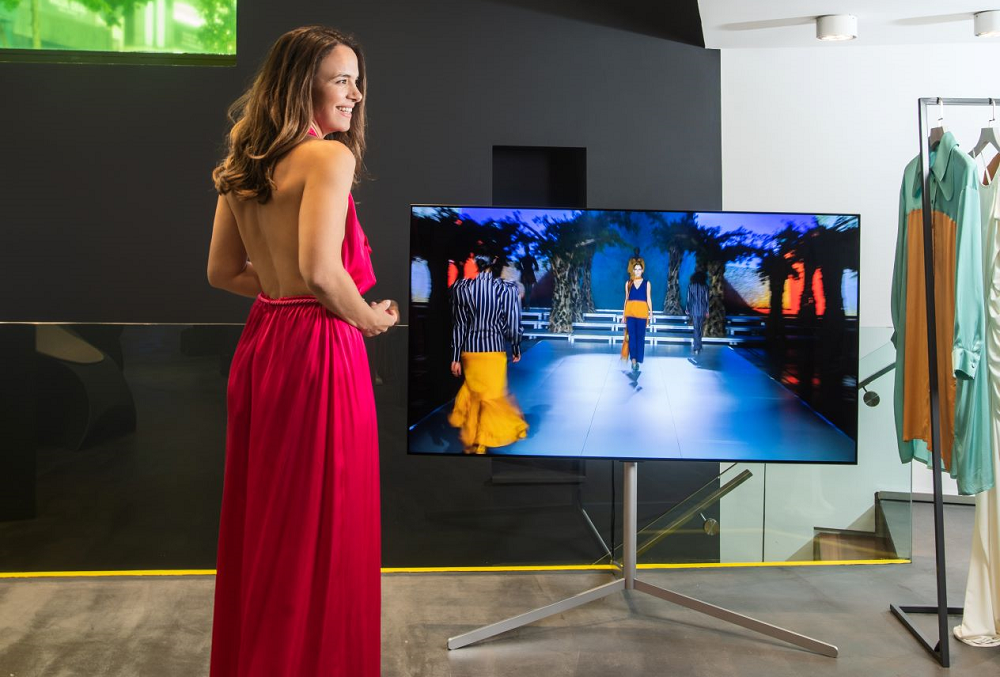 Influencer Eliana Chrysikopoulou pictured with LG G1 OLED at Koudounaris’s showroom