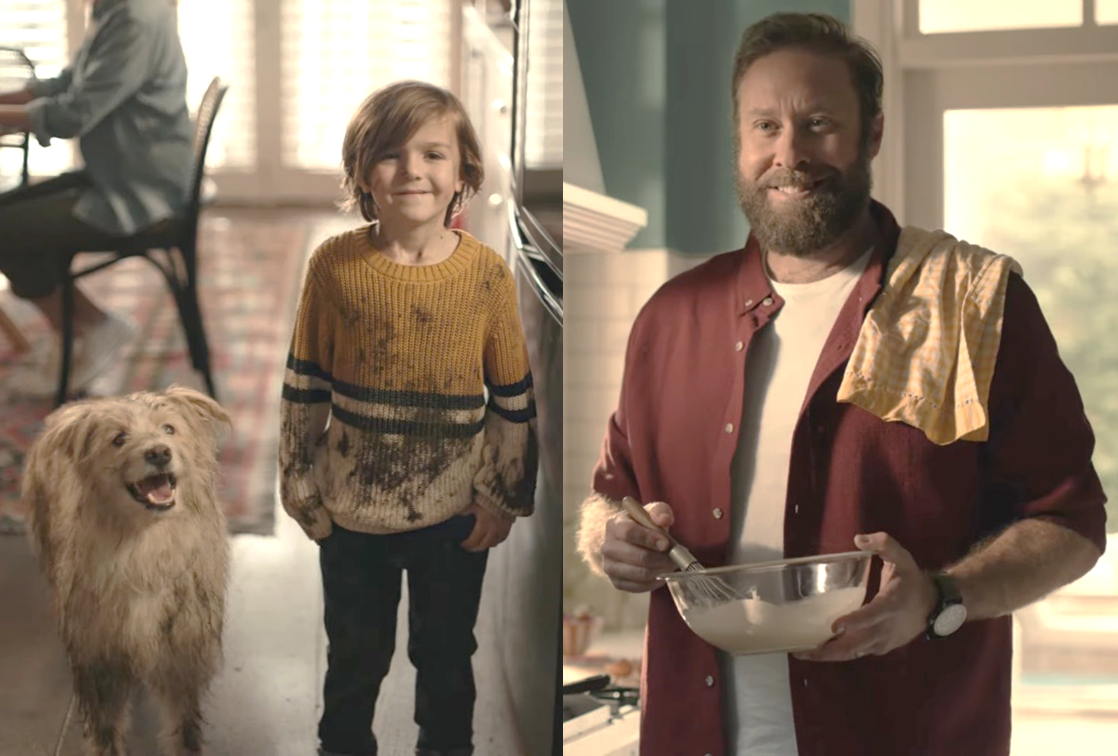 A dad can't help but smile at his son and dog who are both covered in mud.