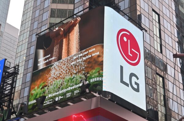 a photo of LG Hope Screen on the building with sand and plants on the screen