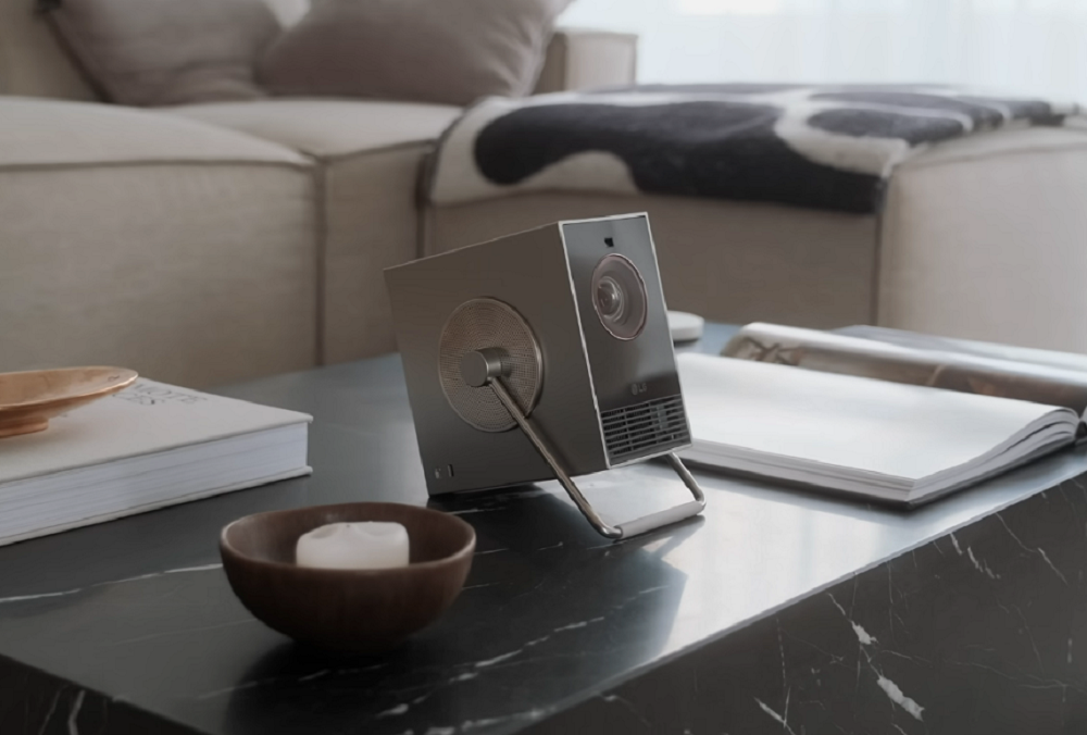 A photo of LG CineBeam Q projector on a living room table